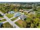 An aerial view showcasing a new home community with multiple houses and roads at 12550 Mohican Ave, Port Charlotte, FL 33953