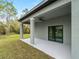 Covered patio with ceiling fan offering a view of the backyard at 12550 Mohican Ave, Port Charlotte, FL 33953