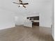Open living room with tile floors and views into the kitchen area at 12550 Mohican Ave, Port Charlotte, FL 33953