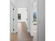 Hallway with tile floors and access to bedrooms at 12550 Mohican Ave, Port Charlotte, FL 33953