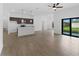 Open concept living room and kitchen with tile flooring at 12550 Mohican Ave, Port Charlotte, FL 33953