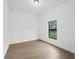 Well-lit bedroom with tile floors and window at 12550 Mohican Ave, Port Charlotte, FL 33953