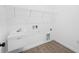 Laundry room with utility sink and shelving at 12550 Mohican Ave, Port Charlotte, FL 33953