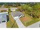 Aerial view of a new construction home with a paved driveway and surrounding landscape at 12550 Mohican Ave, Port Charlotte, FL 33953