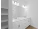 Double vanity bathroom with white cabinets, quartz countertops, and tile flooring at 12550 Mohican Ave, Port Charlotte, FL 33953
