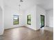 Bright dining room features tile floors and a modern chandelier at 12550 Mohican Ave, Port Charlotte, FL 33953
