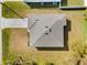 Top-down aerial view of a new single-Gathering home with a gray roof at 12550 Mohican Ave, Port Charlotte, FL 33953