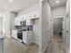 Modern kitchen featuring white cabinets and stainless steel appliances at 1417 Longson St, Port Charlotte, FL 33953