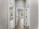 Bright hallway with tile flooring and access to other rooms at 1417 Longson St, Port Charlotte, FL 33953