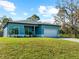 Newly built teal home with paver driveway at 1417 Longson St, Port Charlotte, FL 33953