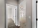 Hallway connecting rooms, featuring tile floors and neutral walls at 1417 Longson St, Port Charlotte, FL 33953