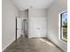 Bedroom with double doors leading to closet and access to hallway at 1417 Longson St, Port Charlotte, FL 33953