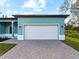 White garage door and paver driveway at 1417 Longson St, Port Charlotte, FL 33953