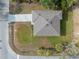 Aerial view of a home showcasing its roof, driveway, and landscaping at 3376 Dunbar St, Port Charlotte, FL 33948