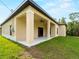 Inviting back porch with ceiling fan and dark-trimmed double doors offers outdoor living at 3376 Dunbar St, Port Charlotte, FL 33948