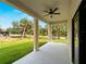 Back porch with ceiling fan and view of a large, green yard at 3376 Dunbar St, Port Charlotte, FL 33948