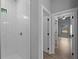 Modern bathroom features a tiled shower with a sleek, contemporary design and neutral color palette at 3376 Dunbar St, Port Charlotte, FL 33948