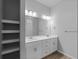 Bathroom featuring double sink vanity, modern lighting, and spacious layout at 3376 Dunbar St, Port Charlotte, FL 33948