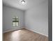 Well-lit bedroom with tile floors, neutral walls, and a window providing natural light and outdoor views at 3376 Dunbar St, Port Charlotte, FL 33948