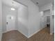 Bright entryway featuring light gray walls, a white front door with a window, and tile flooring at 3376 Dunbar St, Port Charlotte, FL 33948