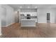 Bright, open living area with a kitchen island, recessed lighting, and tile floors for a seamless design at 3376 Dunbar St, Port Charlotte, FL 33948