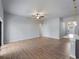 Open living area showcasing wood-look tile flooring, recessed lighting, and a modern ceiling fan at 3376 Dunbar St, Port Charlotte, FL 33948