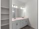 Bathroom featuring double sink vanity with tile backsplash at 4081 Felhorn St, Port Charlotte, FL 33948