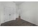 Spacious room with modern flooring, double closets, and an open doorway at 4081 Felhorn St, Port Charlotte, FL 33948