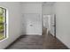 Bedroom with view of hallway and large windows at 4081 Felhorn St, Port Charlotte, FL 33948