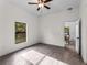 Bright and airy bedroom with wood-look flooring and open doorway at 4081 Felhorn St, Port Charlotte, FL 33948