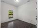 Bright bedroom featuring modern tile floors, natural light and neutral paint at 4081 Felhorn St, Port Charlotte, FL 33948