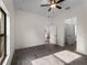 Spacious bedroom with tile floors, a ceiling fan, and an open doorway at 4081 Felhorn St, Port Charlotte, FL 33948