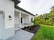 A well-maintained lawn and landscaping accent this modern single story home, complete with a covered front entry at 4081 Felhorn St, Port Charlotte, FL 33948