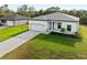 A beautifully landscaped front yard complements this lovely single-Gathering home with paver driveway at 4081 Felhorn St, Port Charlotte, FL 33948