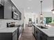 Modern kitchen with stainless steel appliances, white subway tile backsplash, and spacious countertops at 4081 Felhorn St, Port Charlotte, FL 33948