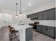Kitchen with stainless steel appliances and a white countertop island at 4081 Felhorn St, Port Charlotte, FL 33948