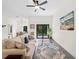 Comfortable living room with stylish decor, a sliding glass door, and natural light at 4081 Felhorn St, Port Charlotte, FL 33948