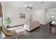 Bright living room with tile flooring, a ceiling fan, and a comfortable seating area at 4081 Felhorn St, Port Charlotte, FL 33948