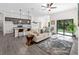 Contemporary open floorplan featuring a kitchen with a breakfast bar and a comfortable living space at 4081 Felhorn St, Port Charlotte, FL 33948