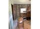 Inside, a home under construction displays appliance boxes and exposed framework, highlighting its renovation potential at 612 Milus St, Punta Gorda, FL 33950