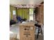 A renovation interior showcases appliance boxes and exposed framework, highlighting the home's potential at 612 Milus St, Punta Gorda, FL 33950