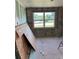 This is a room under construction with visible wall framing, exposed block and plywood against the wall at 612 Milus St, Punta Gorda, FL 33950