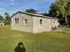 Newly constructed home with stucco exterior and a spacious yard at 612 Milus St, Punta Gorda, FL 33950