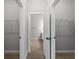 Bright hallway with two large closets and access to bathroom at 173 Edgemere Nw St, Port Charlotte, FL 33948