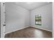 Well-lit bedroom with a window and tile flooring at 173 Edgemere Nw St, Port Charlotte, FL 33948