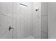 Clean shower with white tile and a rain shower head at 173 Edgemere Nw St, Port Charlotte, FL 33948
