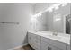 Modern bathroom with double vanity, tile flooring, and updated fixtures at 173 Edgemere Nw St, Port Charlotte, FL 33948