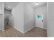 Bright entryway with tile flooring and access to laundry and other rooms at 173 Edgemere Nw St, Port Charlotte, FL 33948