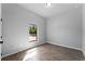 Simple bedroom with window and tile flooring at 173 Edgemere Nw St, Port Charlotte, FL 33948