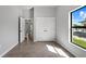 Sunny bedroom with large window and tile flooring at 173 Edgemere Nw St, Port Charlotte, FL 33948